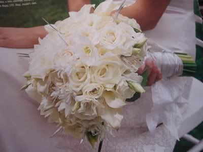 Bridal bouquet Two dozen white ivory roses with a few mini white calla 