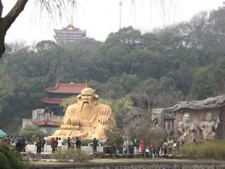 Some Taoist statuses with the hilly background