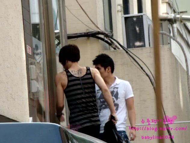 Actually I think it's Yoochun that has the tattoo around his hip 