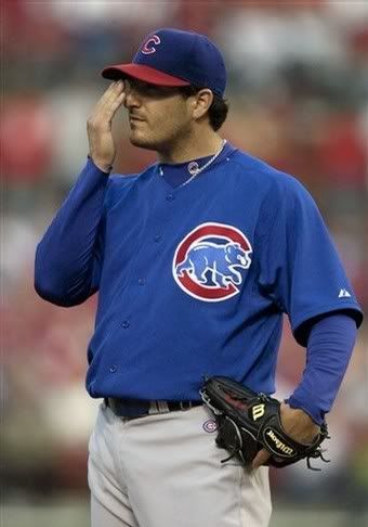 Jason Marquis Is he...smelling his hand?