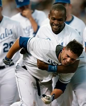 DeJesus and Jose Guillen celebrate the victory.