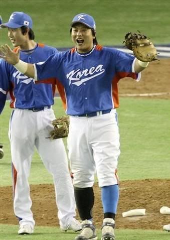 Korea Celebration Koreas 1B, Kim Tae-kyun celebates after kicking Japan into 2nd place in Pool A. (AP Photo)